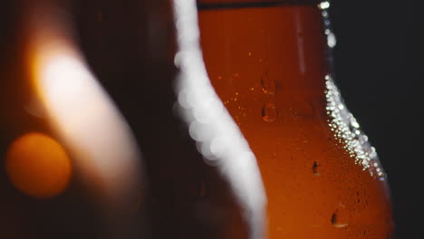 close up of condensation droplets on bottles of cold beer or soft drinks 1