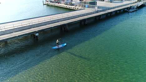 flying over paddle boarder