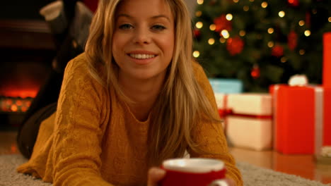 Pretty-blonde-enjoying-a-hot-drink