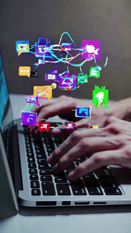 hands typing on a laptop keyboard with colorful digital icons floating above
