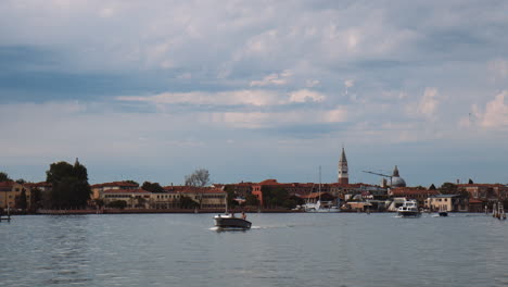 venetian grand canal with historical architectures at background in venice, northern italy