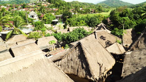 Tradtional-Sade-village-in-Indonesia-rooftops-on-sunny-day,-aerial-view