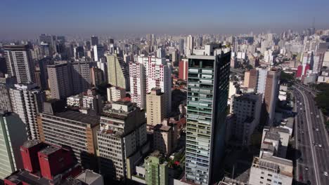 Aerial-view-over-vibrant-buildings-in-Consolação,-sunny-Sao-Paulo,-Brazil