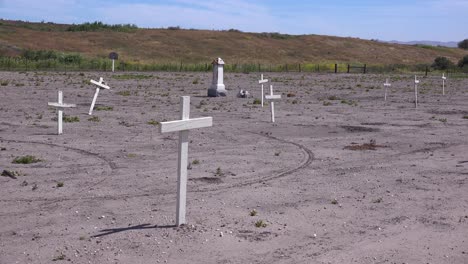 the graves of unknown mexican immigrant hispanic farm workers are marked by crosses in a graveyard cemetery near guadeloupe 2