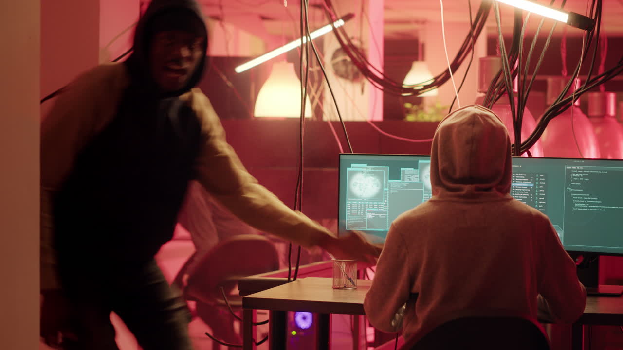 Hackers coding in a dark room