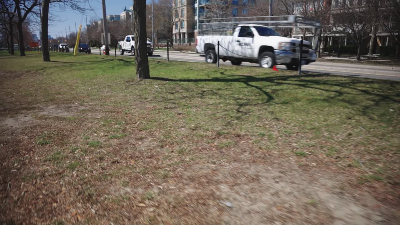 Cars Driving On The Street Without Traffic On A Sunny Day - wide shot
