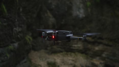 drone in flight over rocky terrain