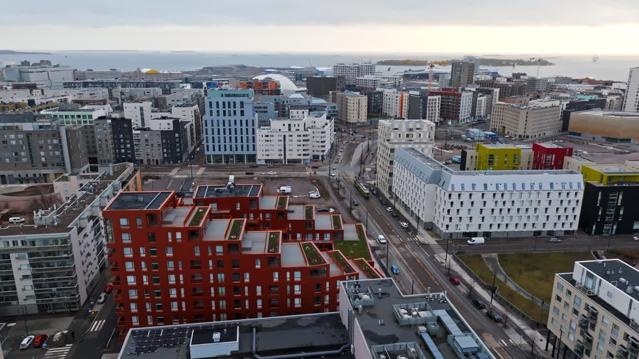 Aerial view rising behind a tram on the streets of Helsinki, evening n Finland