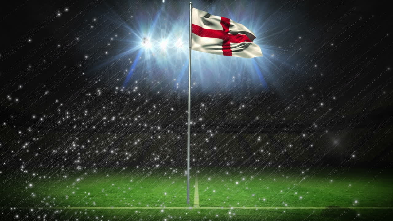 비어있는 경기장에서 조명에 대항하여 기둥에 있는 잉글랜드의 발 위에 조명된 입자의 애니메이션