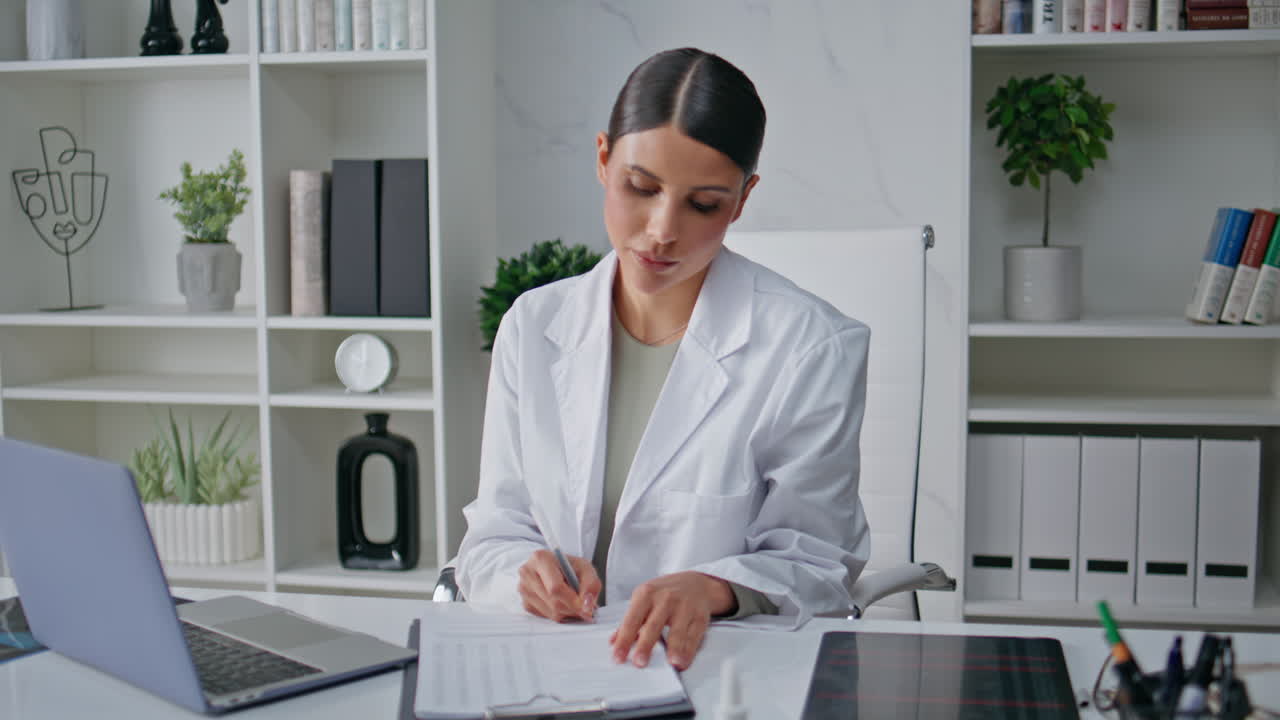 Medical professional concentrating documentation analysis in hospital office