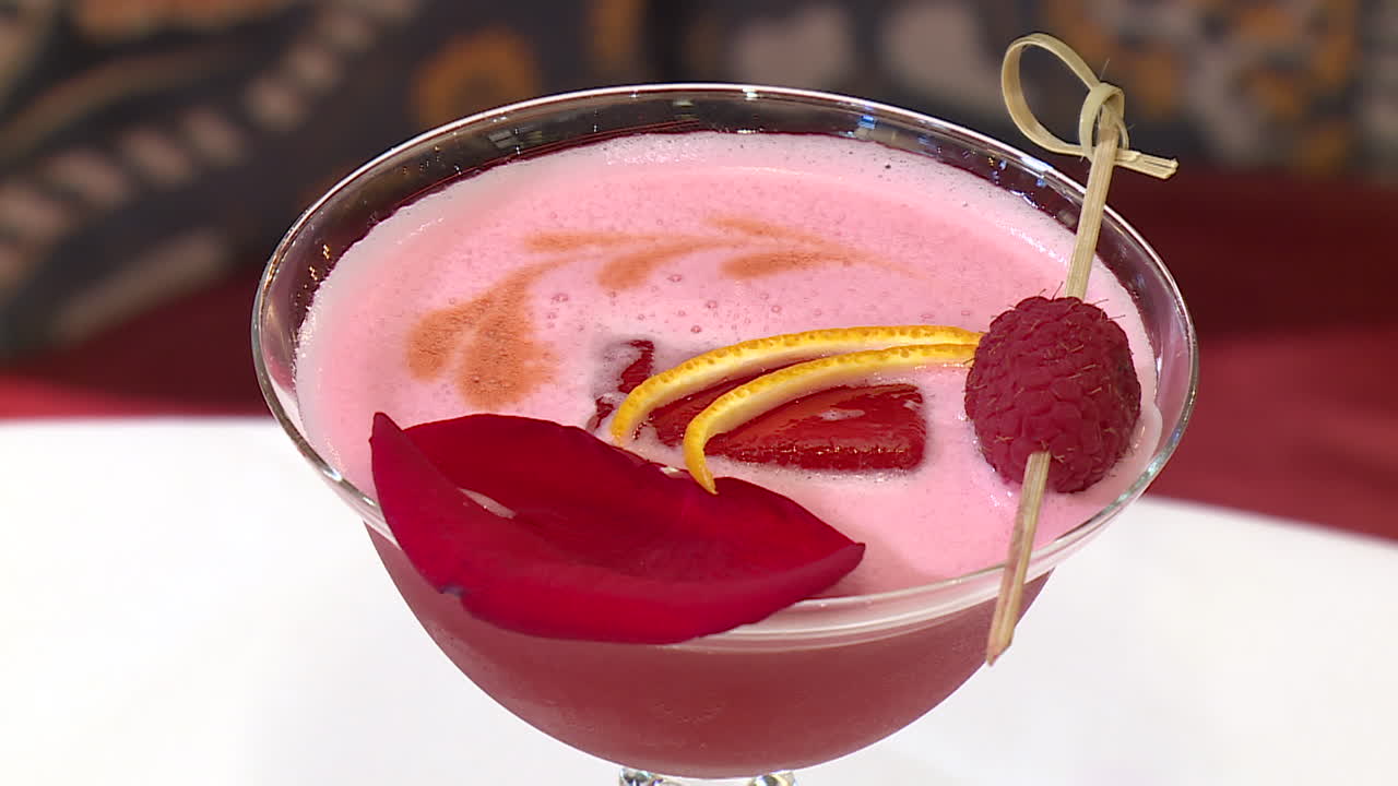 Elegant Pink Cocktail with Rose Petal and Raspberry