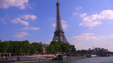 a point of view of the eiffel tower from a bateaux mouche riverboat traveling along the seine river in paris 1