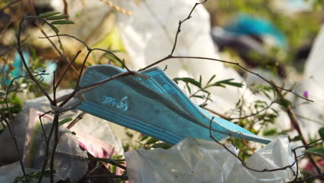 land of vietnam covered with plastic garbage and face protective mask on windy day