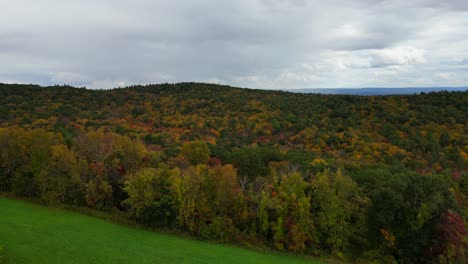 Aerial-of-Western-Massachusetts,-with-its-charming-landscapes,-transforms-into-a-mesmerizing-tapestry-of-color-during-the-fall-season