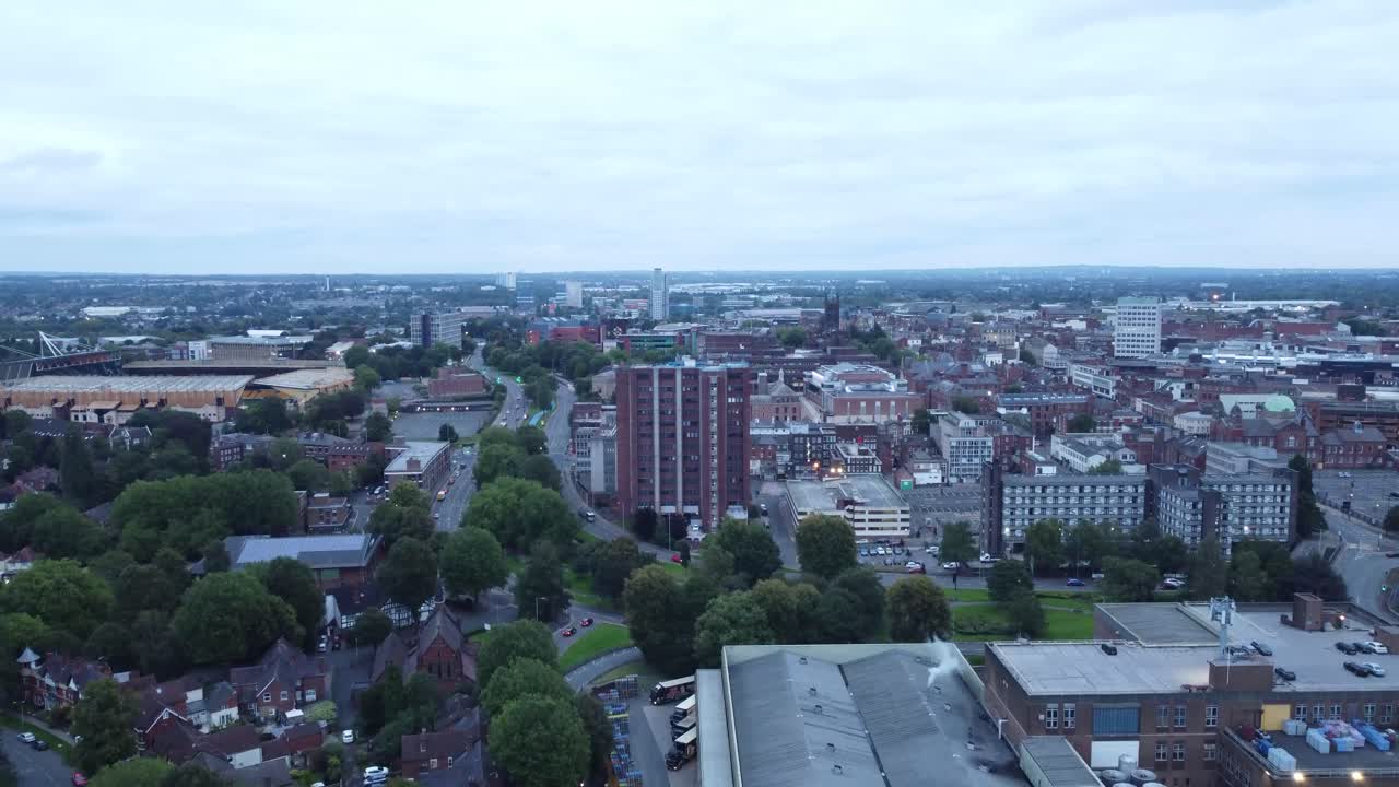 Rising drone shot of a UK city and Football stadium.