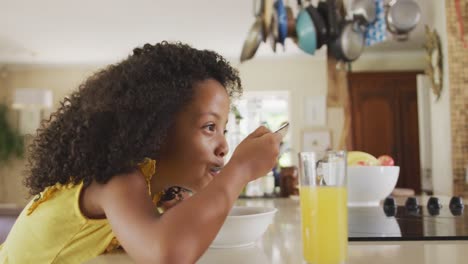 side view of african american girl eating cereals