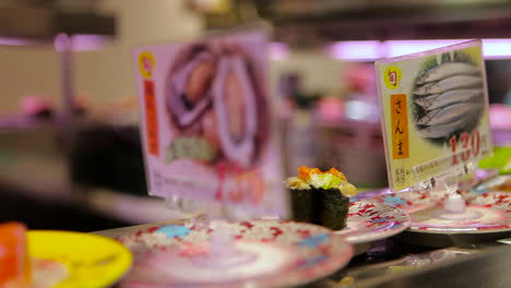 Sushi-items-travel-on-a-conveyor-belt-in-a-restaurant-in-China