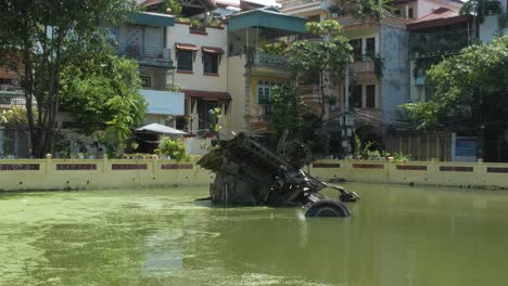 Remnants-of-Vietnam-war,-destroyed-B52-plane,-Huu-Tiep-Lake,-Hanoi-city