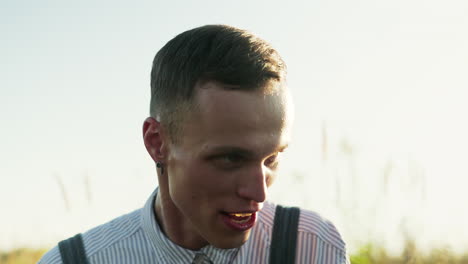 young man talking outdoors