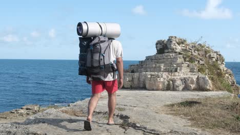 camper boy walking seaside