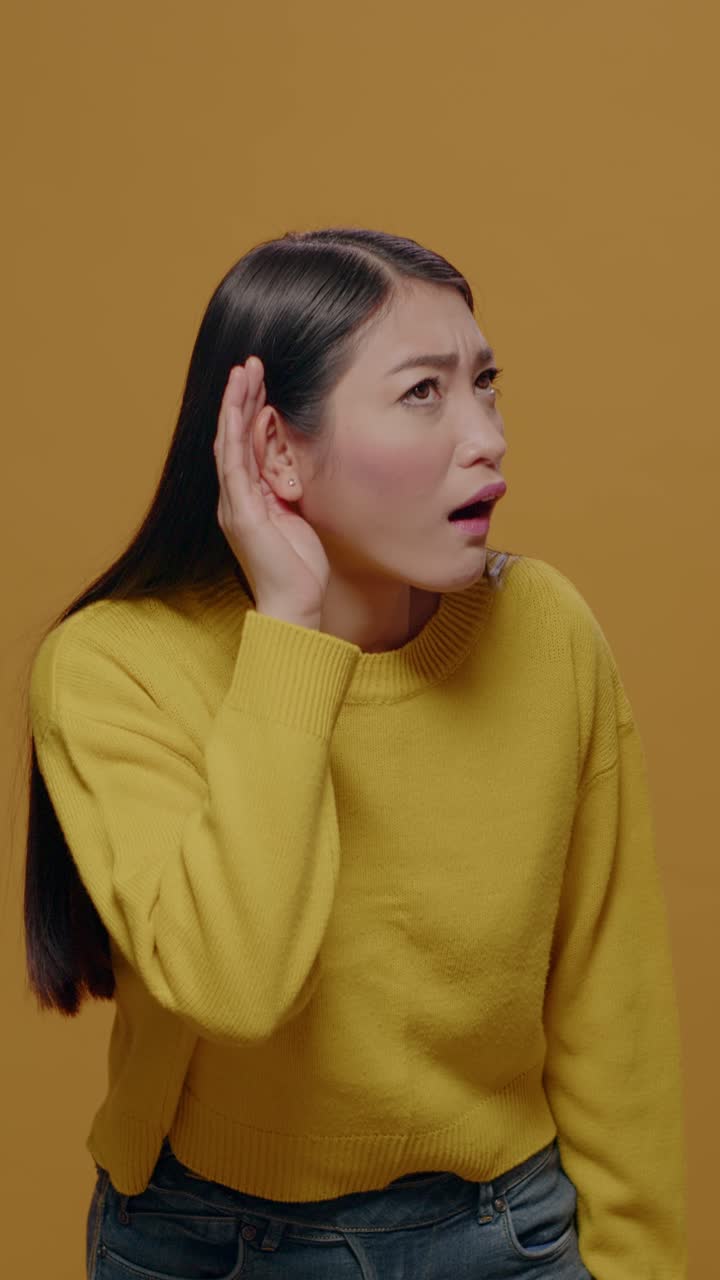 Asian woman listening intently