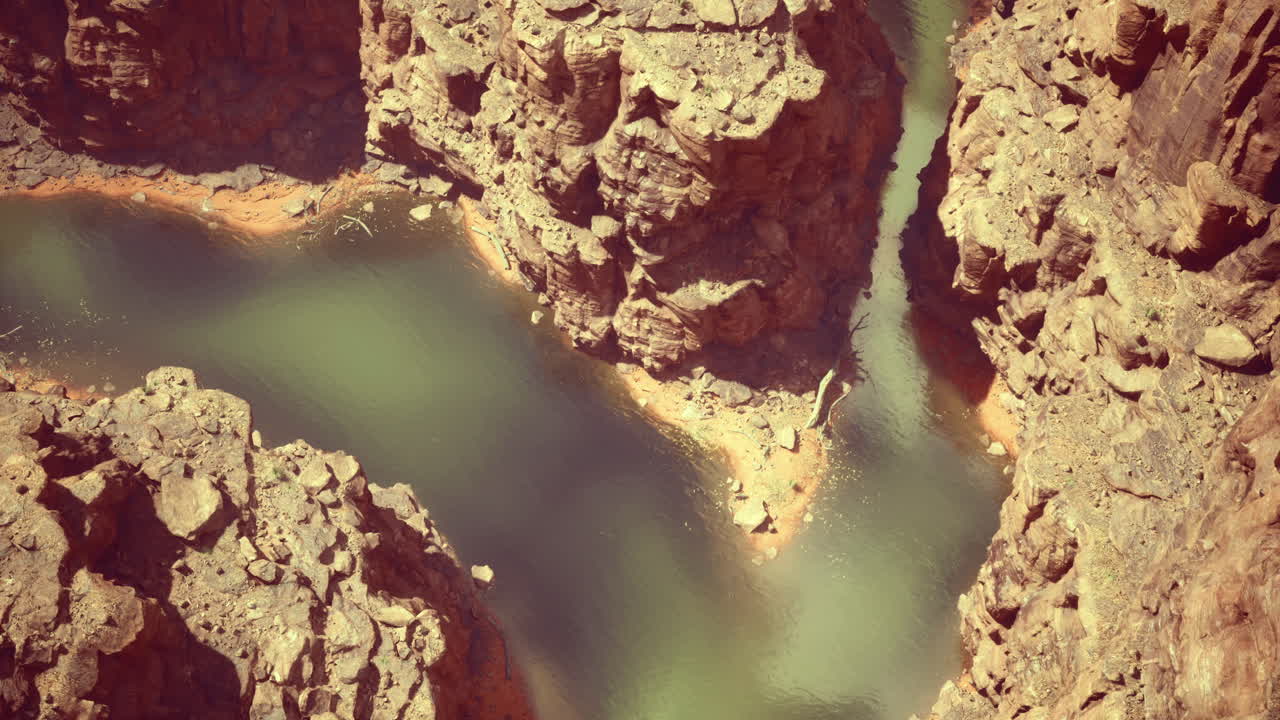 Stunning view of a winding river surrounded by rocky cliffs in a canyon