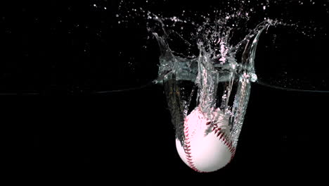 White-baseball-falling-into-water