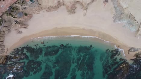 Aerial-of-Chileno-Beach,-known-for-its-stunning-natural-beauty,-clear-turquoise-waters,-abundant-marine-life,-making-it-a-favorite-spot-for-snorkeling-and-swimming