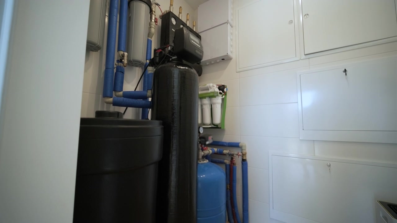 Water Filtration and Softening System Installed in Utility Room