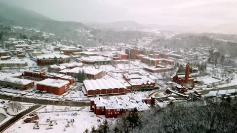 Appalachian-State-reveal-thru-trees,-Boone-NC,-Boone-North-Carolina-in-snow