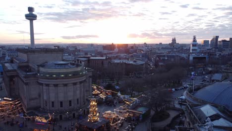 liverpool city sunset skyline christmas market and radio city landmark aerial view pan right