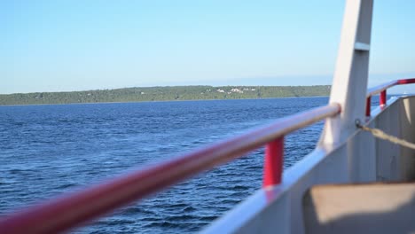 mackinac island state park and large mansions come into view on the ferry crossing