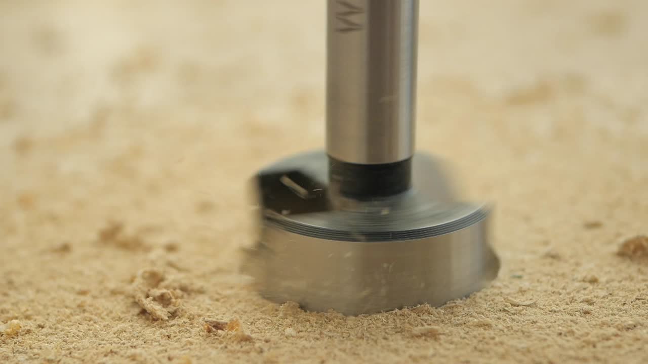 Drilling a hole in wood with a hole saw