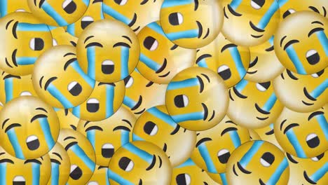 animación de emojis cayendo sobre una mujer en hijab usando una computadora portátil