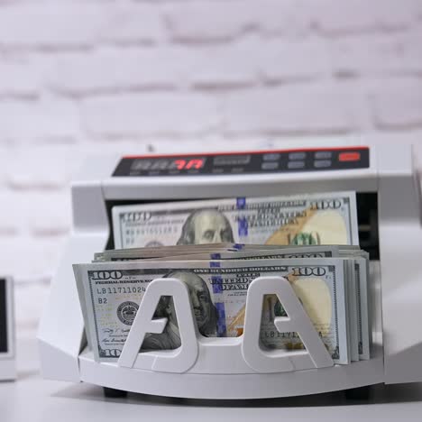 money counting machine. modern electronic bill counter with money, close up