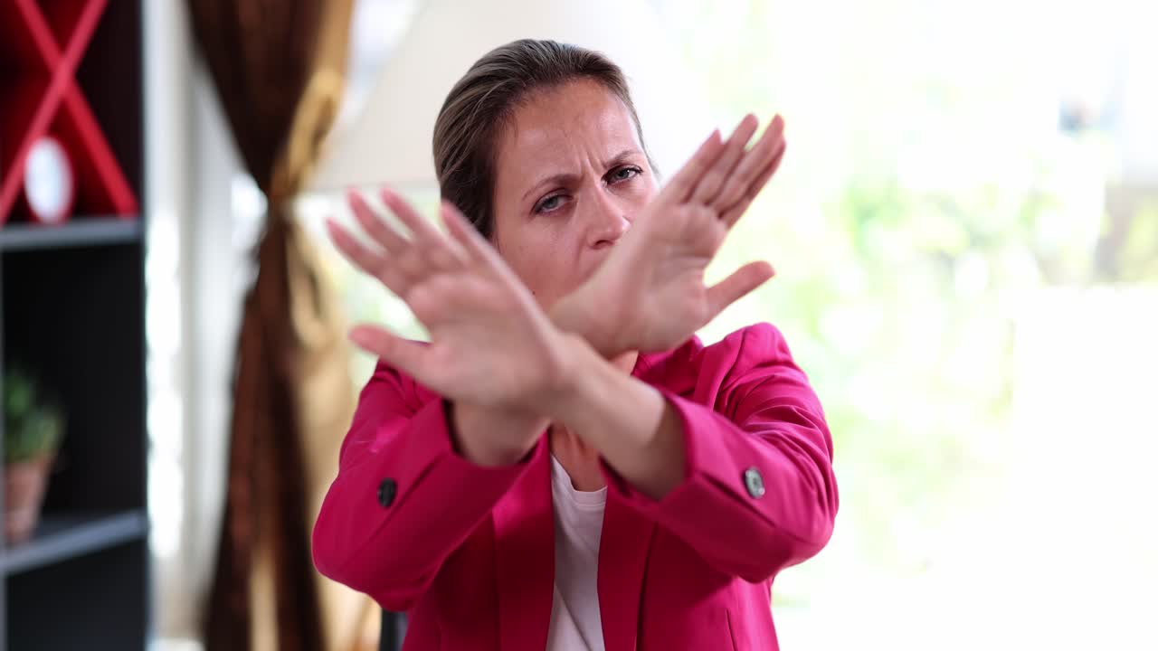 Woman gesturing 'no' with her hand