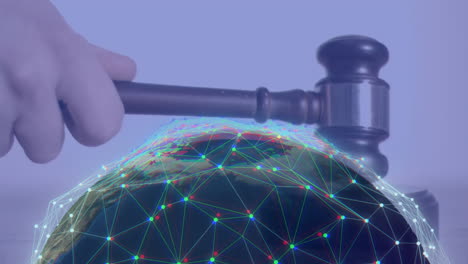 Animation of spinning globe over hand using gavel
