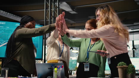 vertical video group of corporate women working on data analysis and setting project goals