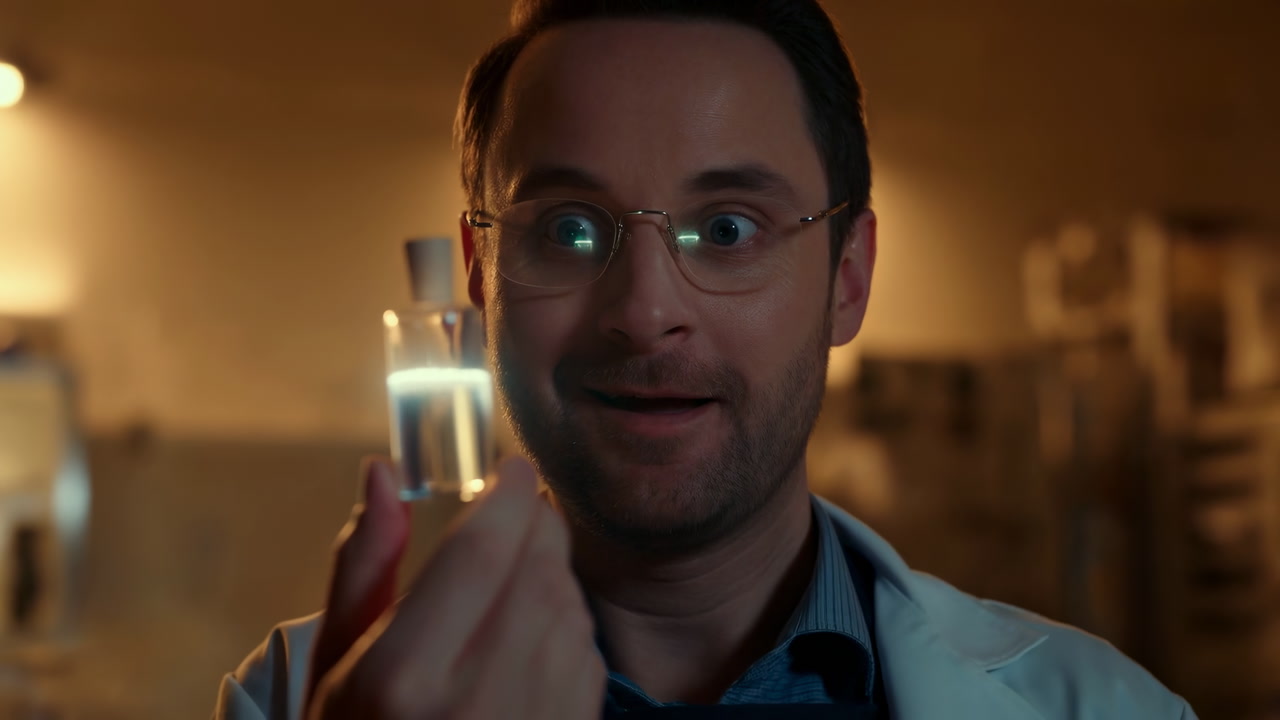 Lab Scientist White Male Holding Vial, Excited Expression And Glasses In Dimly Lit Lab, Warm Backlight,
