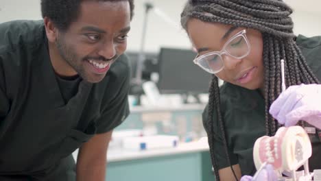 People-working-in-a-laboratory-with-dentures