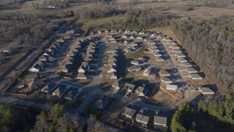 aerial footage flying over a suburban neighborhood in lincoln, alabama, showcasing the layout and serene environment of the area