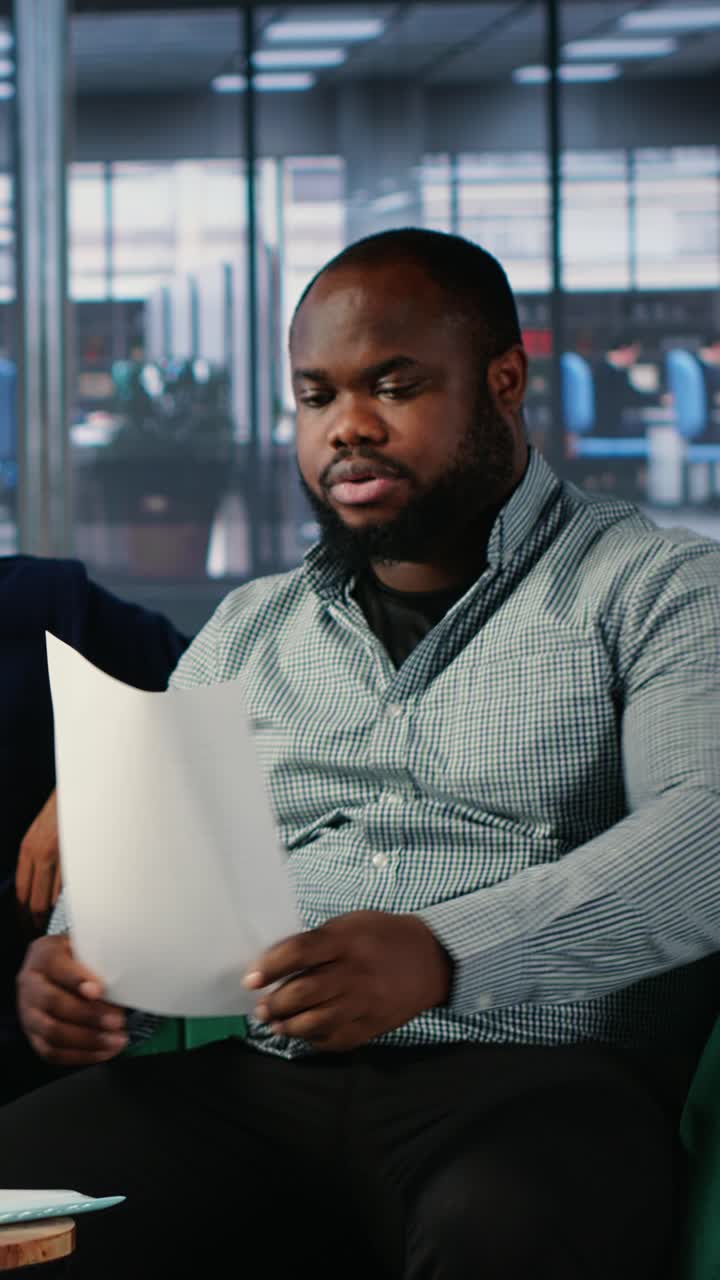 Vertical Video African american leader giving his signature and consent after important meeting