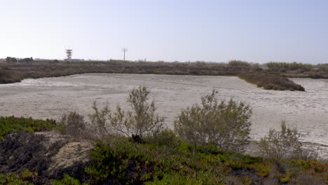 panning shot of a natural salt production area in the south of portugal