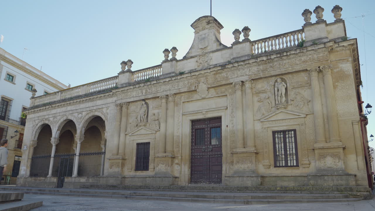 Woman Walks Towards Entry Door Old City Hall of Jerez de la Frontera