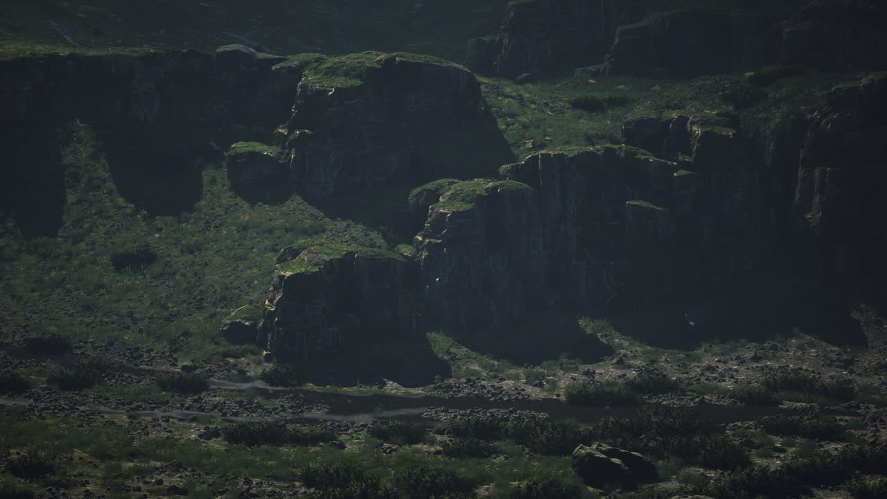Scenic view of rugged cliffs and greenery in remote wilderness landscape