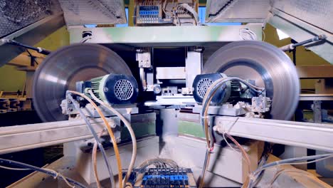 two circular cutters work on a pvc window profile.