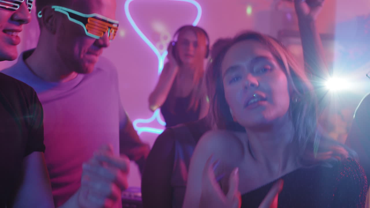 Beautiful Young Woman Dancing at House Party