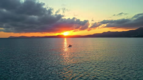 fishing boat over aegean sea during sunset near sitia in crete, greece. wide shot