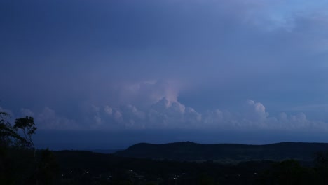 progression of a thunderstorm over a hilly landscape