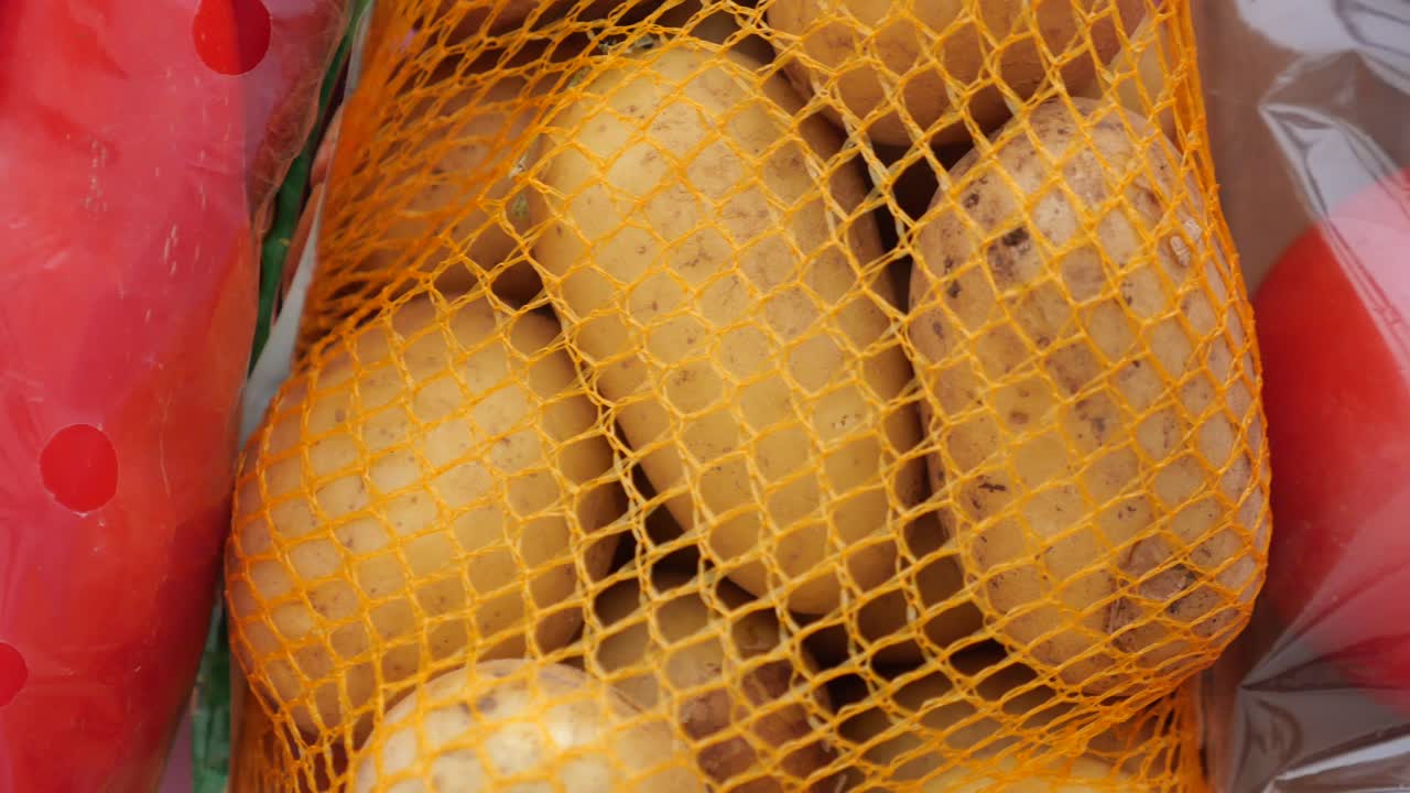 Potatoes and Tomatoes in Mesh Produce Bag